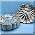S32. Sterling silver butter pats. 